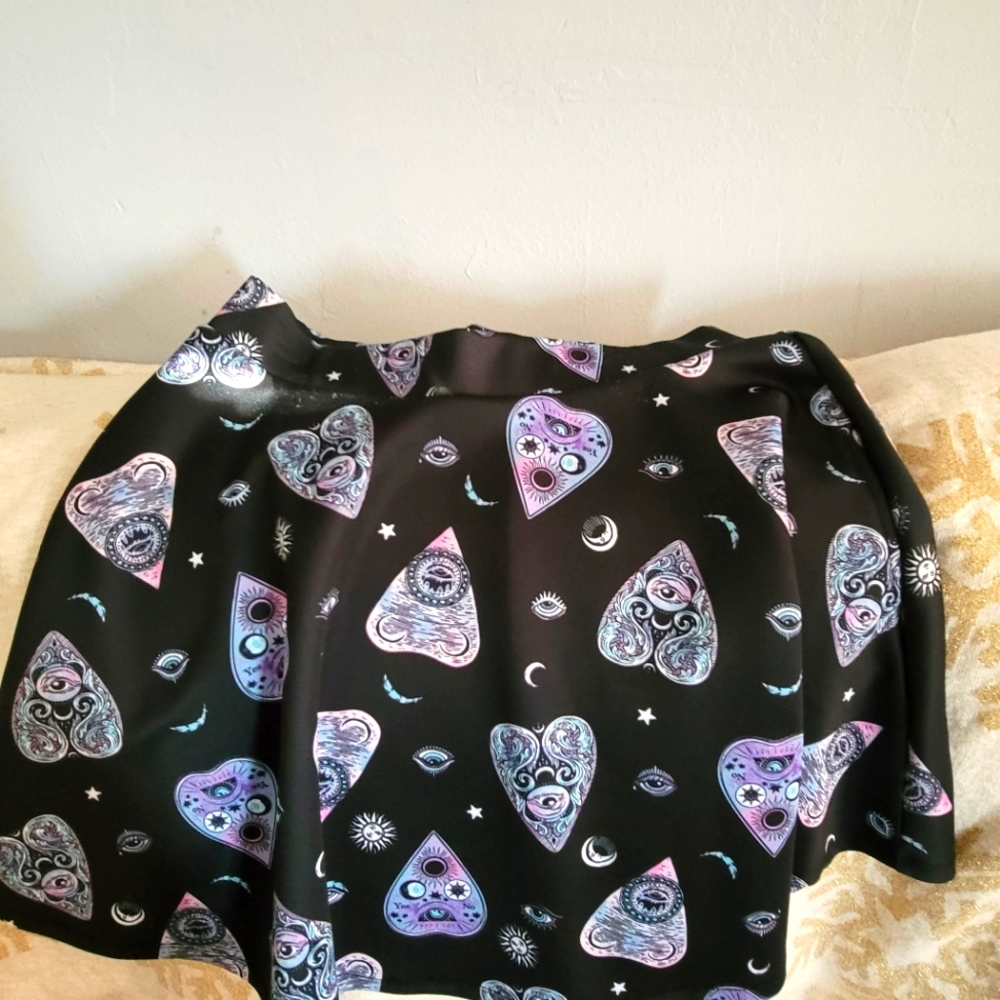 Midnight Hour skirt size XL, Black color with evil eye prints.